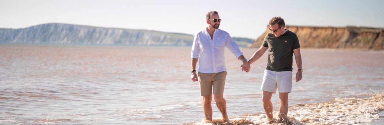 Couple walking at Brook Beach, Isle of Wight